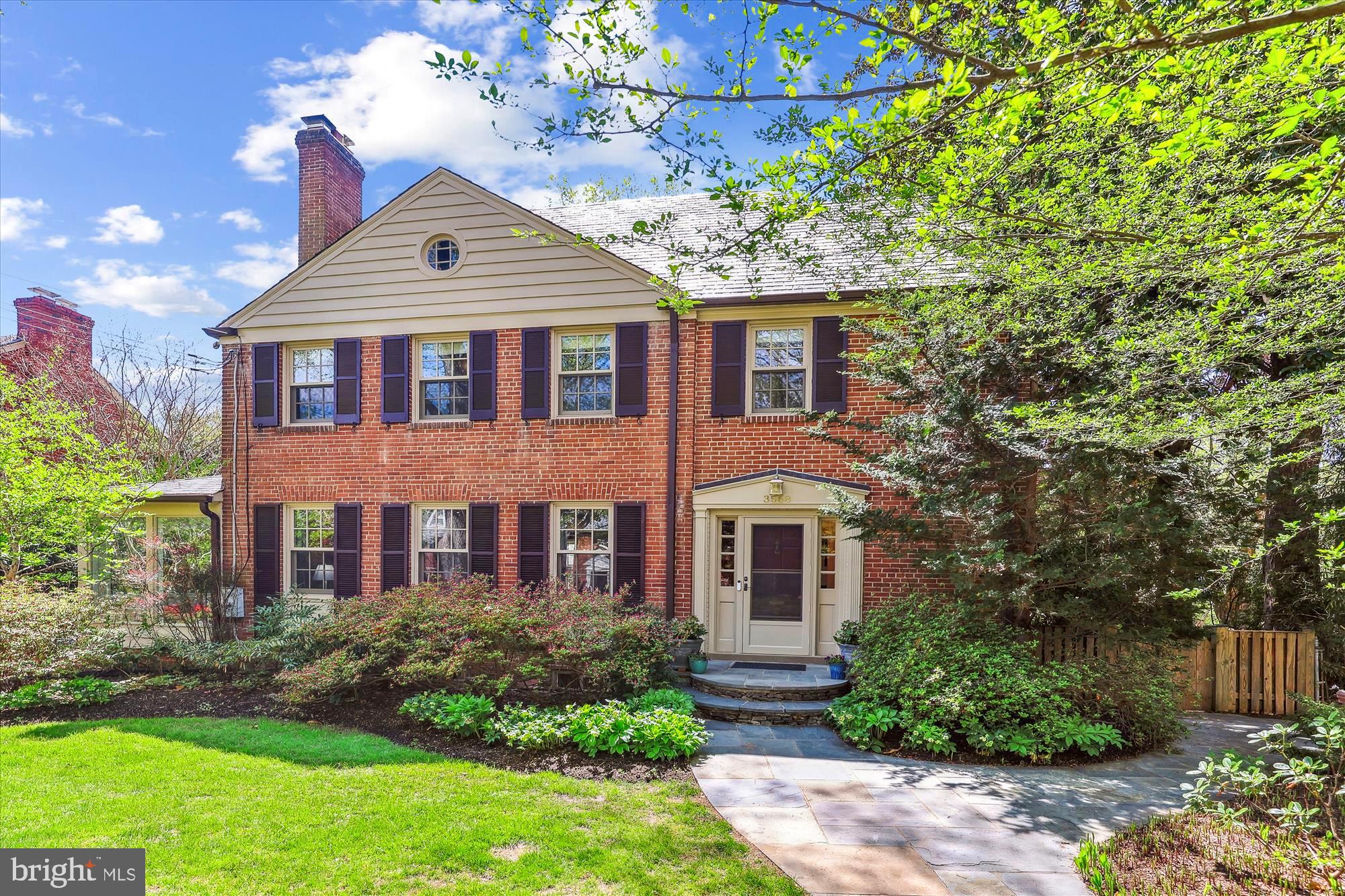 3568 Appleton Street Northwest Washington, DC 20008 - Photo 1 of 57 a front view of a house with a yard