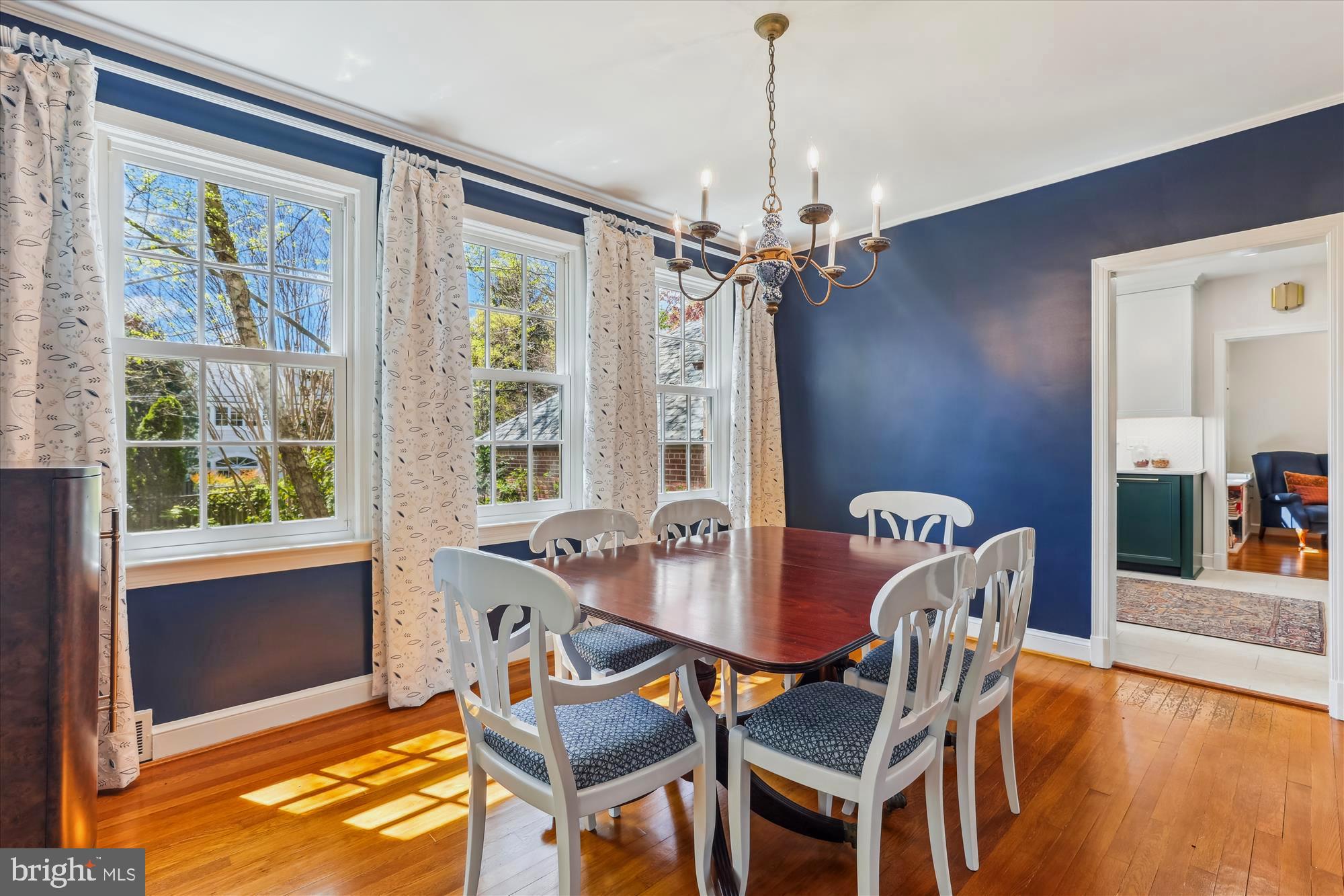 3568 Appleton Street Northwest Washington, DC 20008 - Photo 11 of 57 a dining room with furniture a chandelier and wooden floor