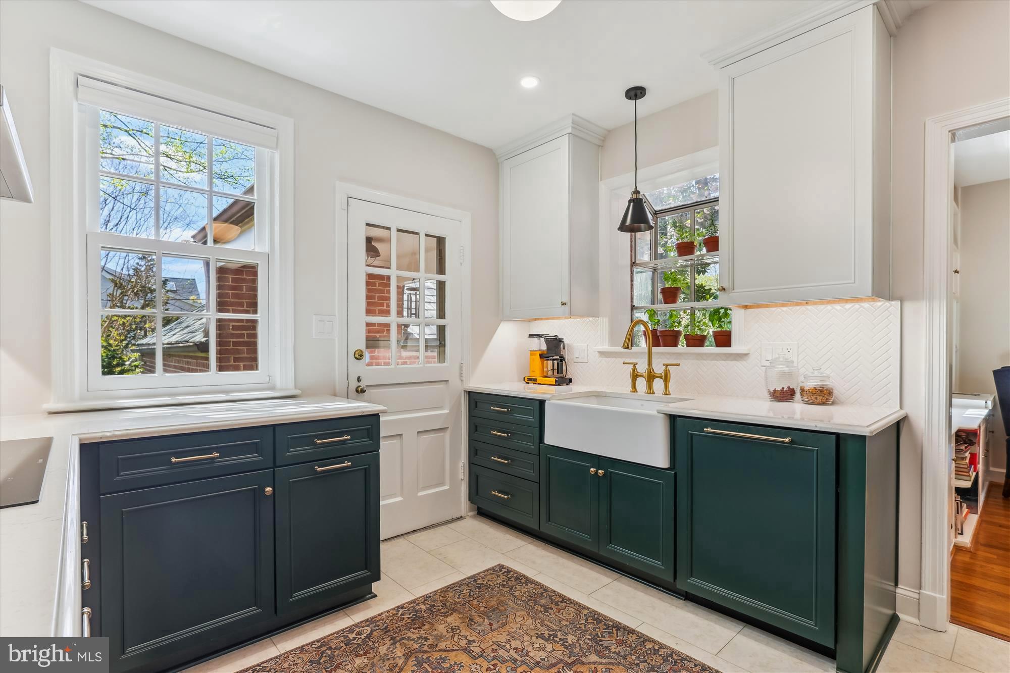 3568 Appleton Street Northwest Washington, DC 20008 - Photo 17 of 57 a kitchen with a sink window and cabinets