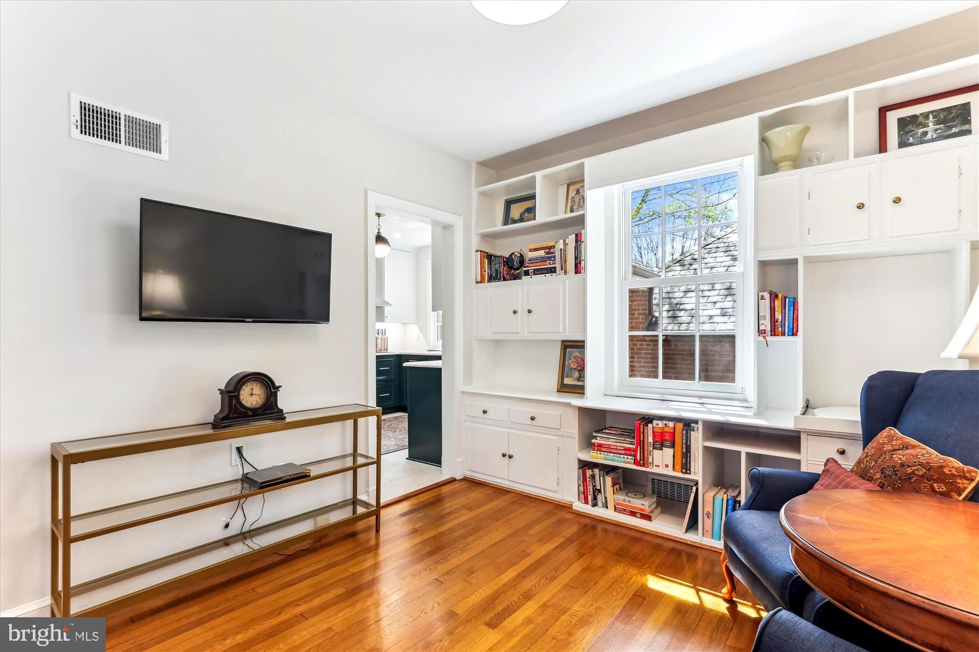 3568 Appleton Street Northwest Washington, DC 20008 - Photo 19 of 57 a bedroom with furniture and a flat screen tv