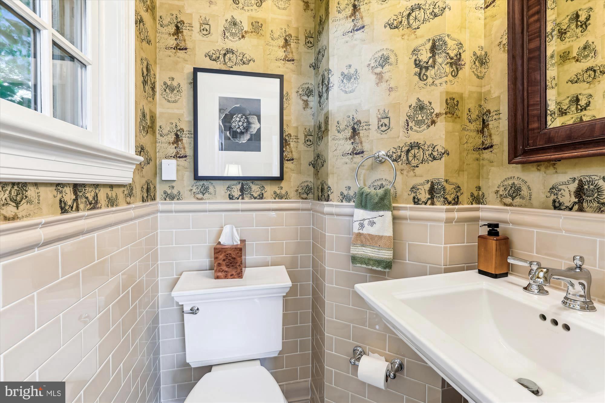 3568 Appleton Street Northwest Washington, DC 20008 - Photo 20 of 57 a bathroom with a sink mirror and toilet