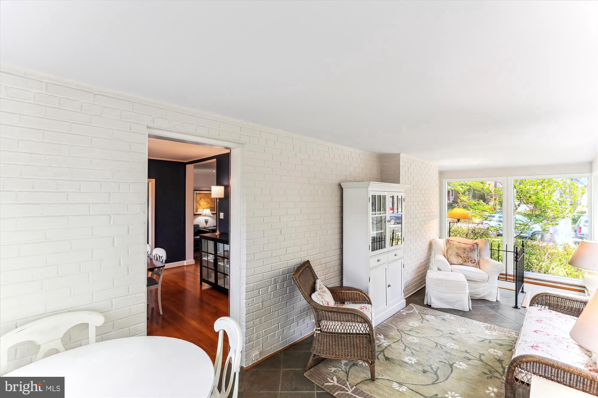 3568 Appleton Street Northwest Washington, DC 20008 - Photo 22 of 57 a living room with furniture a rug and a large window