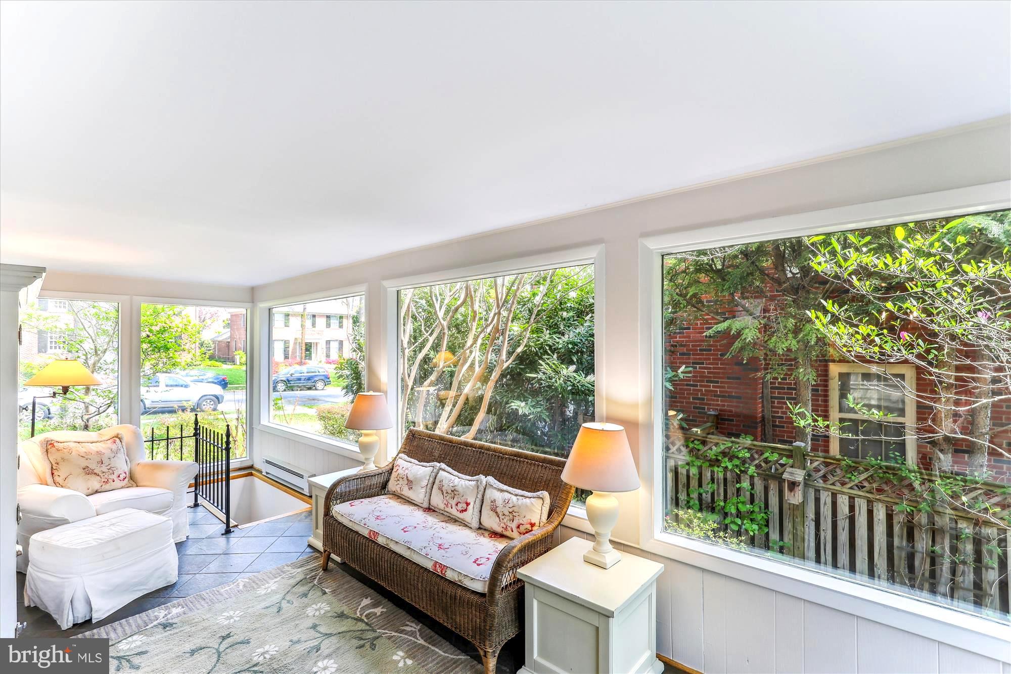 3568 Appleton Street Northwest Washington, DC 20008 - Photo 23 of 57 a living room with furniture and a floor to ceiling window