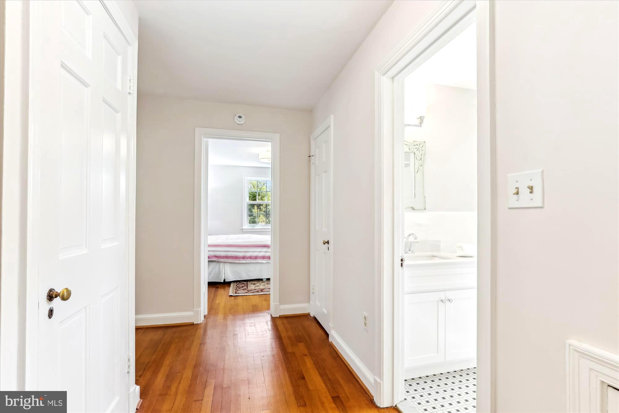 3568 Appleton Street Northwest Washington, DC 20008 - Photo 24 of 57 a view of a hallway with wooden floor and a bathroom