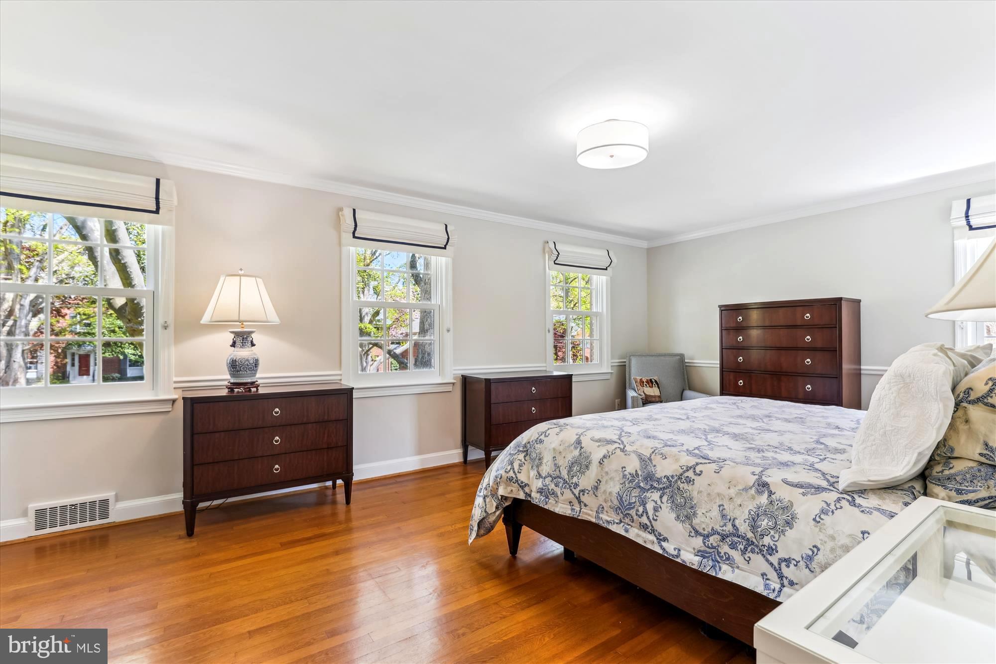 3568 Appleton Street Northwest Washington, DC 20008 - Photo 27 of 57 a bedroom with a bed and a dresser next to a window