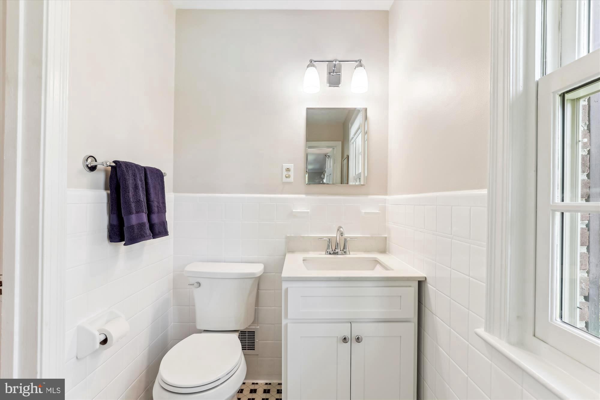 3568 Appleton Street Northwest Washington, DC 20008 - Photo 28 of 57 a bathroom with a toilet sink and mirror