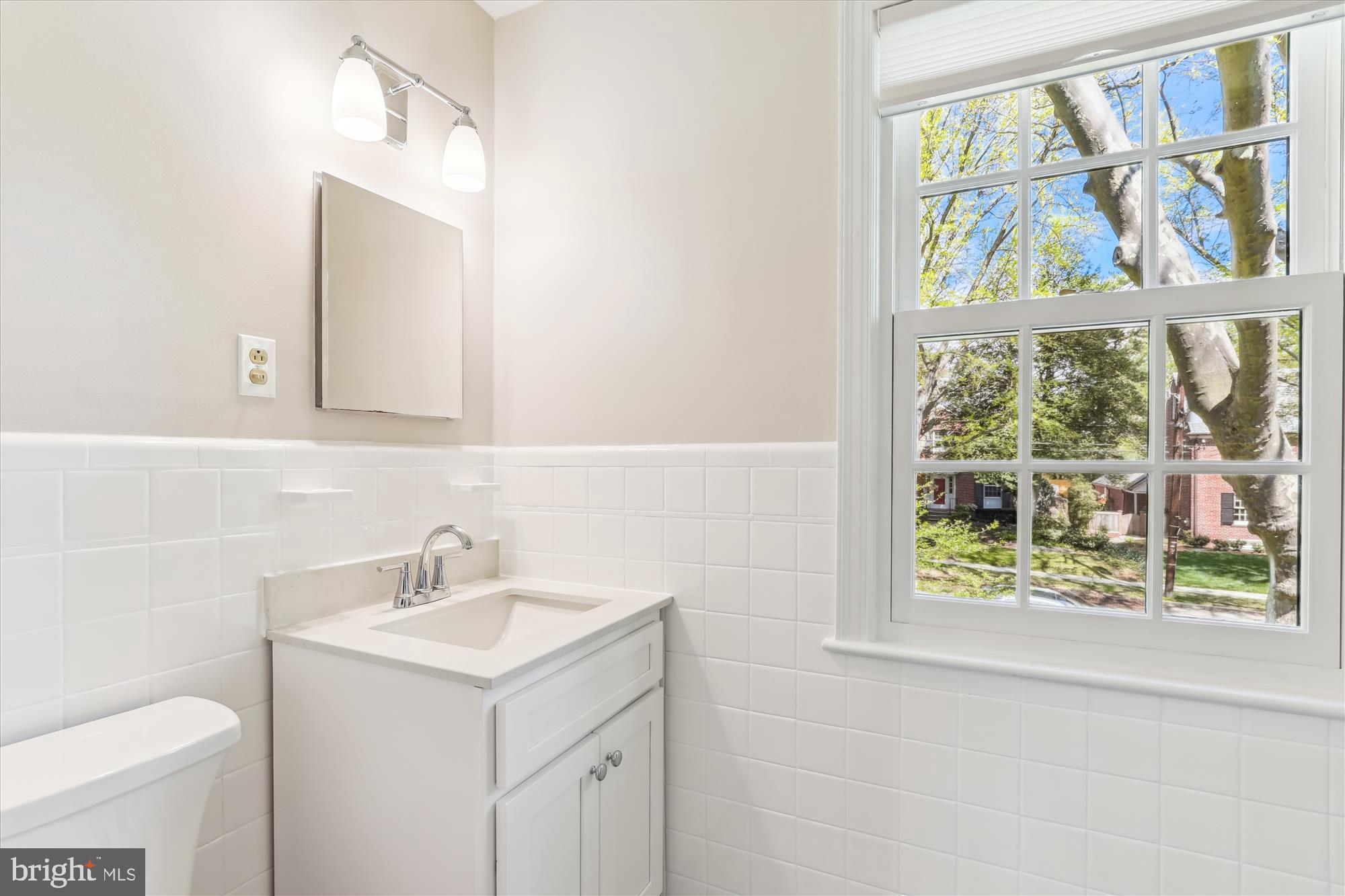 3568 Appleton Street Northwest Washington, DC 20008 - Photo 29 of 57 a bathroom with a sink and a mirror