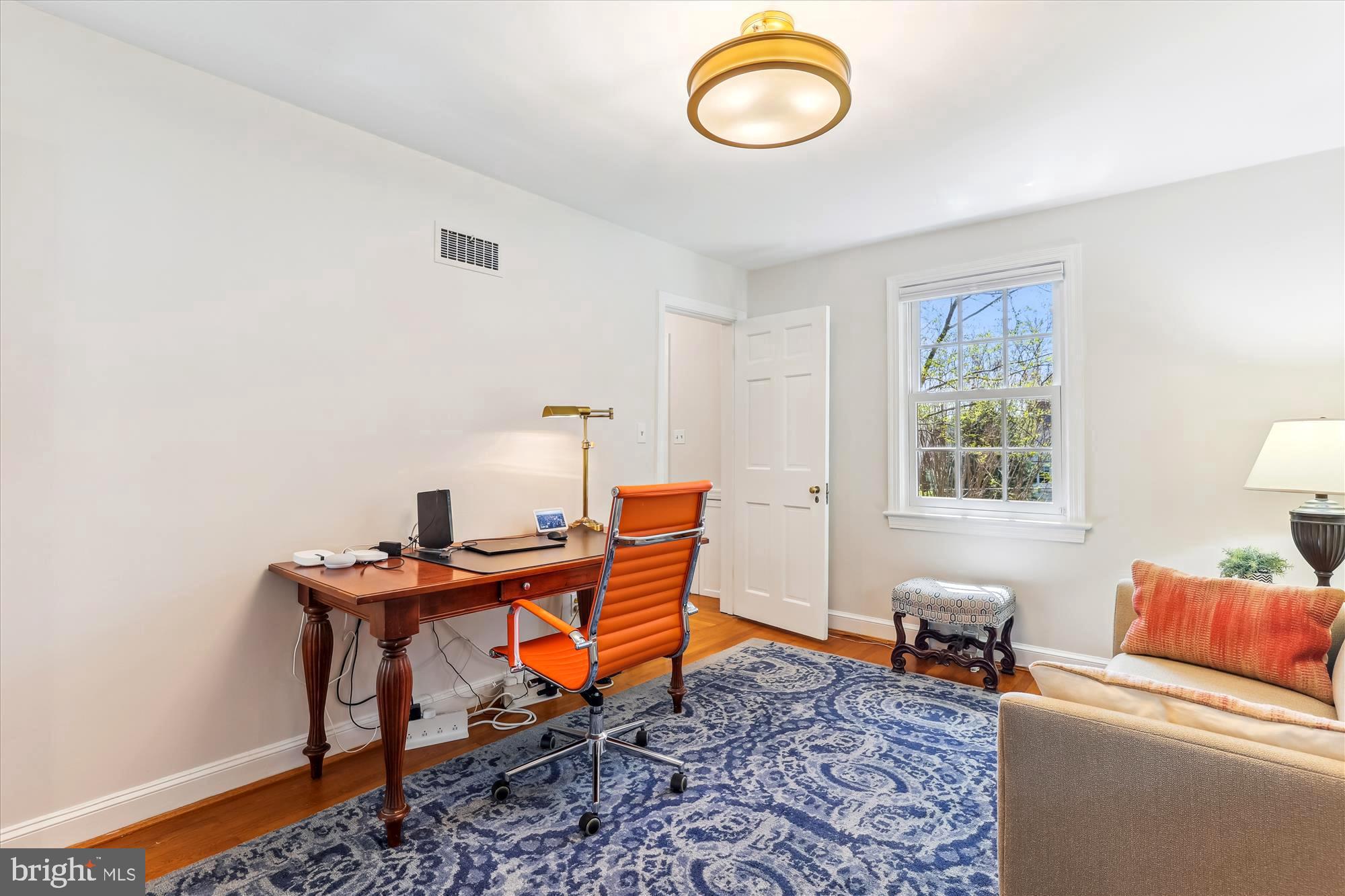 3568 Appleton Street Northwest Washington, DC 20008 - Photo 34 of 57 a view of a workspace with furniture and a window