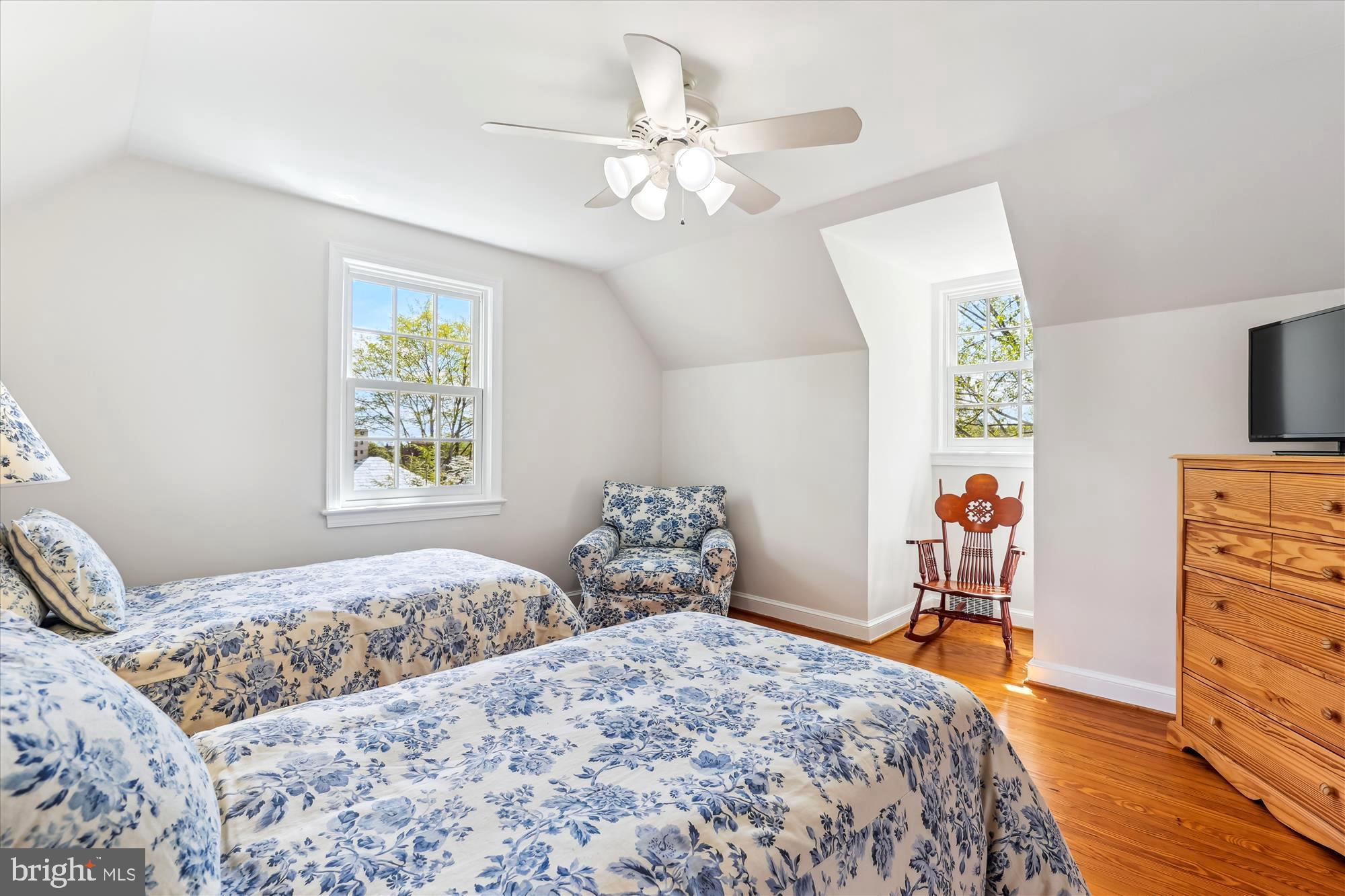 3568 Appleton Street Northwest Washington, DC 20008 - Photo 38 of 57 a bedroom with a bed and a chandelier