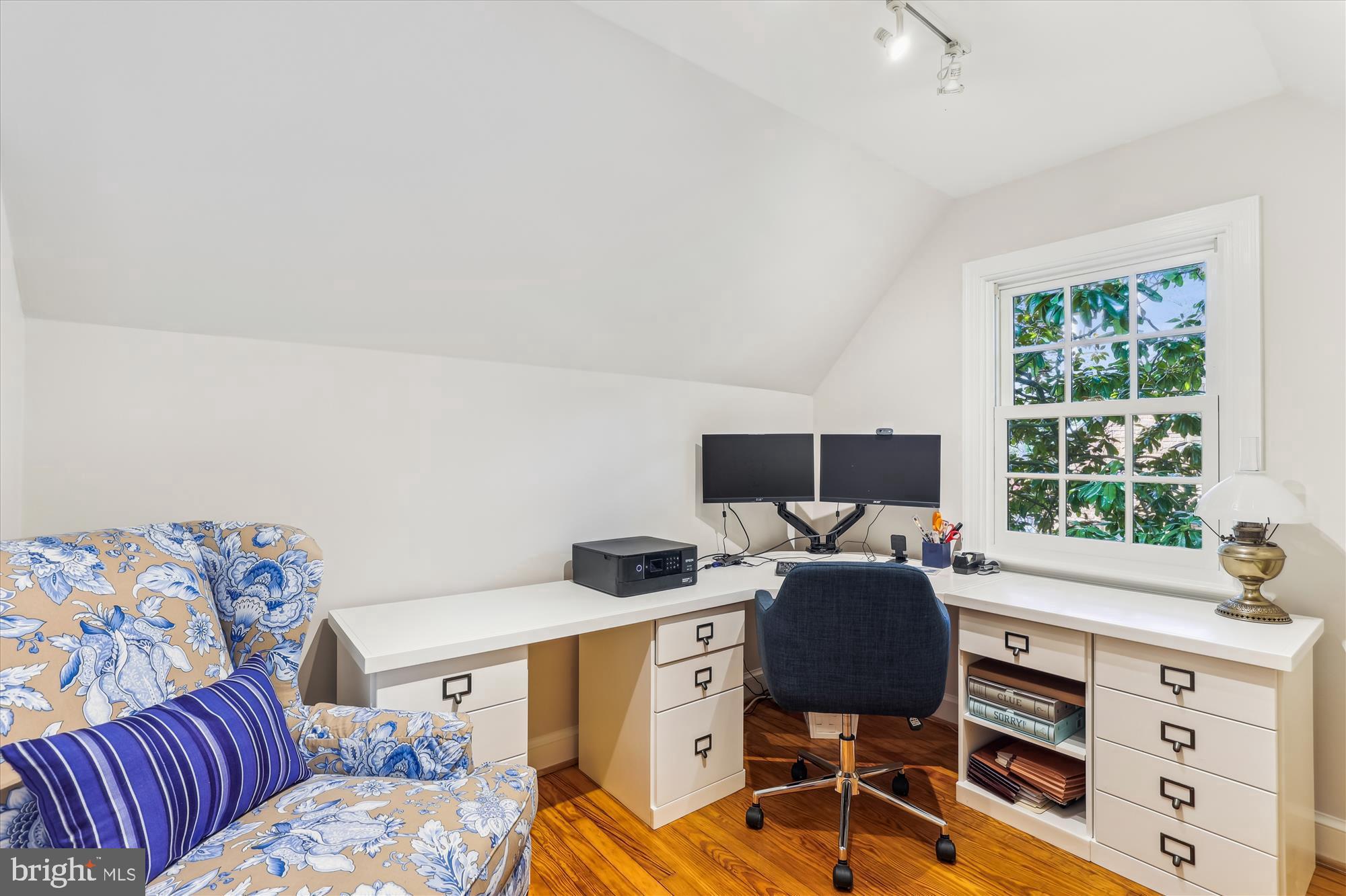 3568 Appleton Street Northwest Washington, DC 20008 - Photo 39 of 57 a view of a workspace with furniture and a window