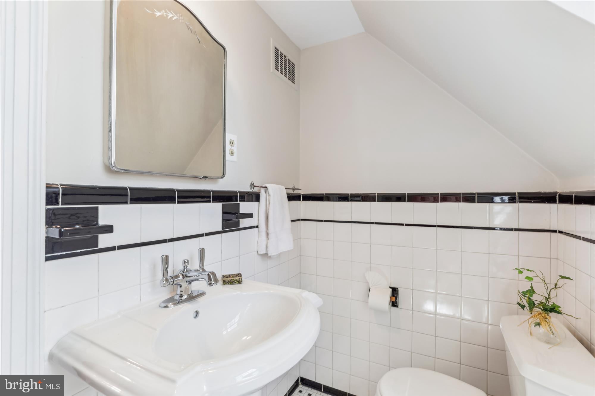 3568 Appleton Street Northwest Washington, DC 20008 - Photo 40 of 57 a bathroom with a sink and a mirror