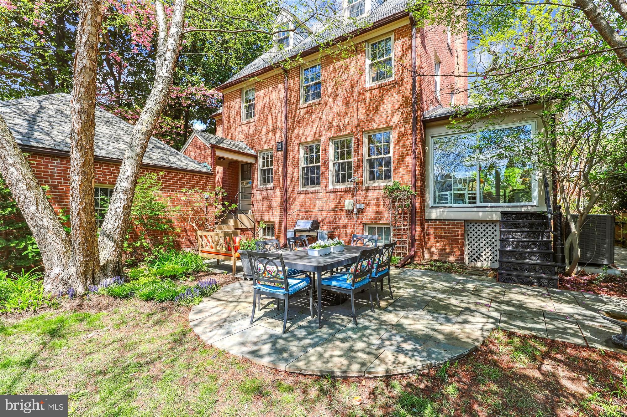 3568 Appleton Street Northwest Washington, DC 20008 - Photo 49 of 57 a view of a house with backyard sitting area and garden