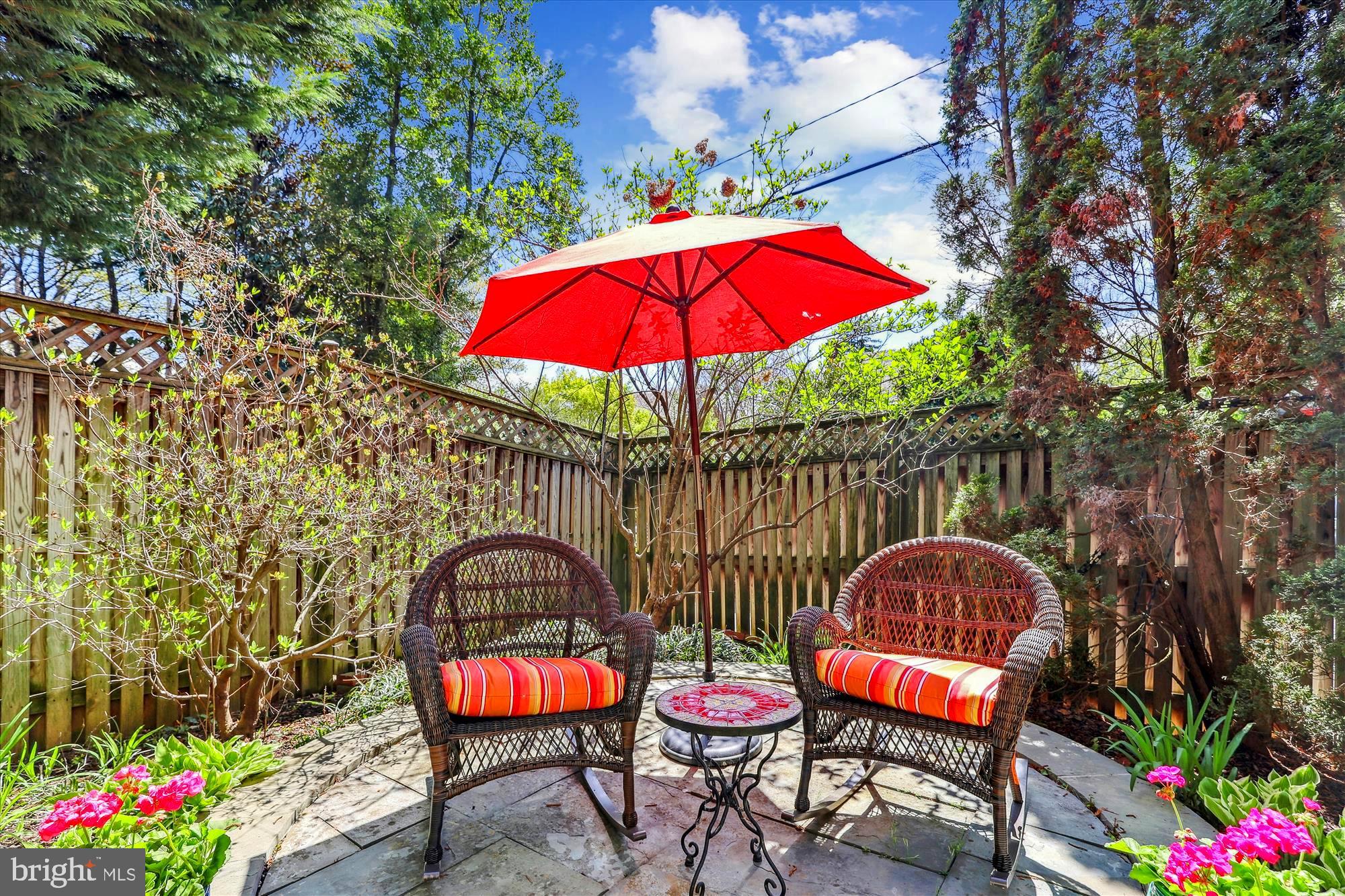 3568 Appleton Street Northwest Washington, DC 20008 - Photo 56 of 57 an outdoor sitting area with chairs and wooden fence