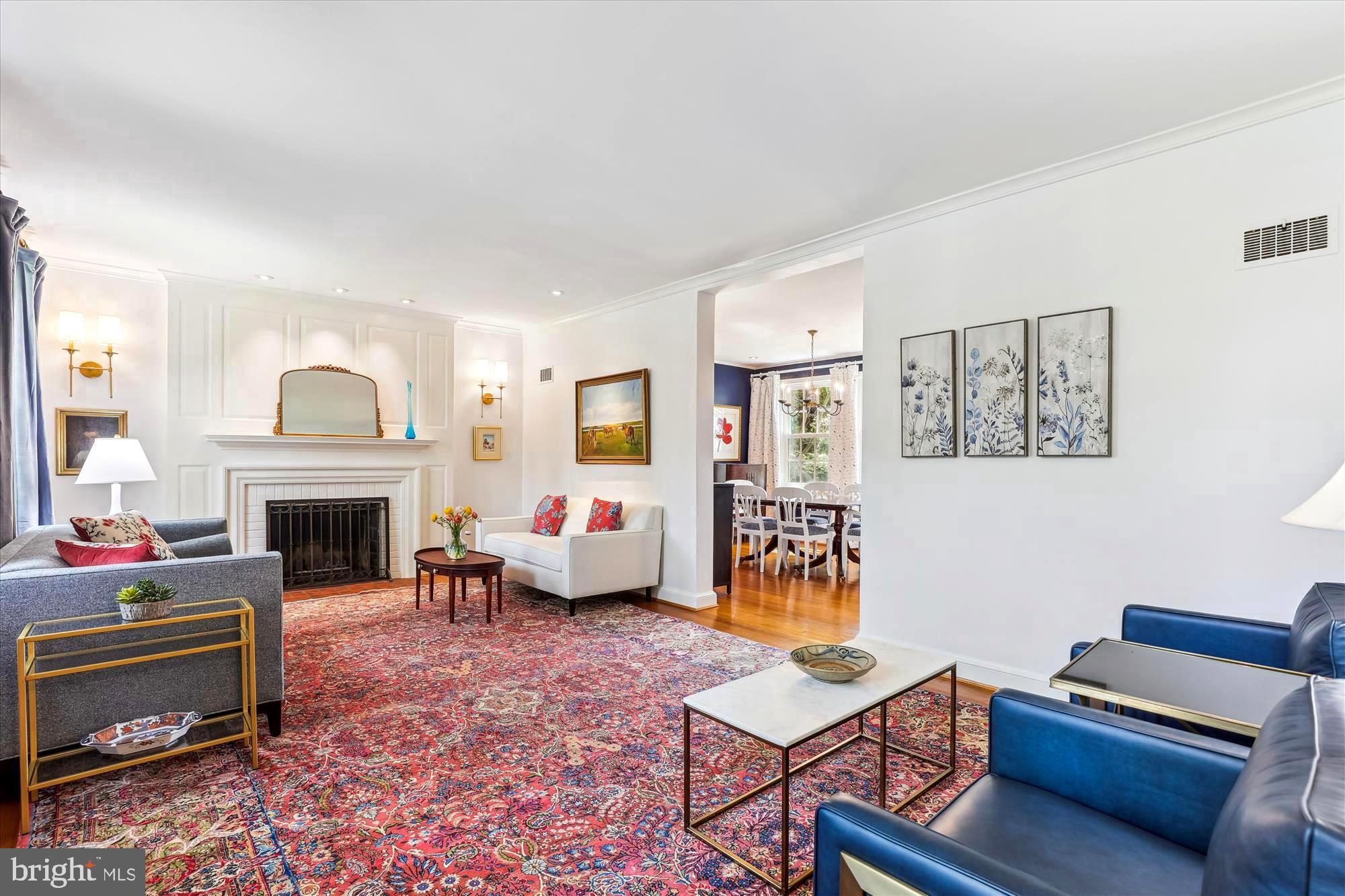 3568 Appleton Street Northwest Washington, DC 20008 - Photo 8 of 57 a living room with furniture a fireplace and a window
