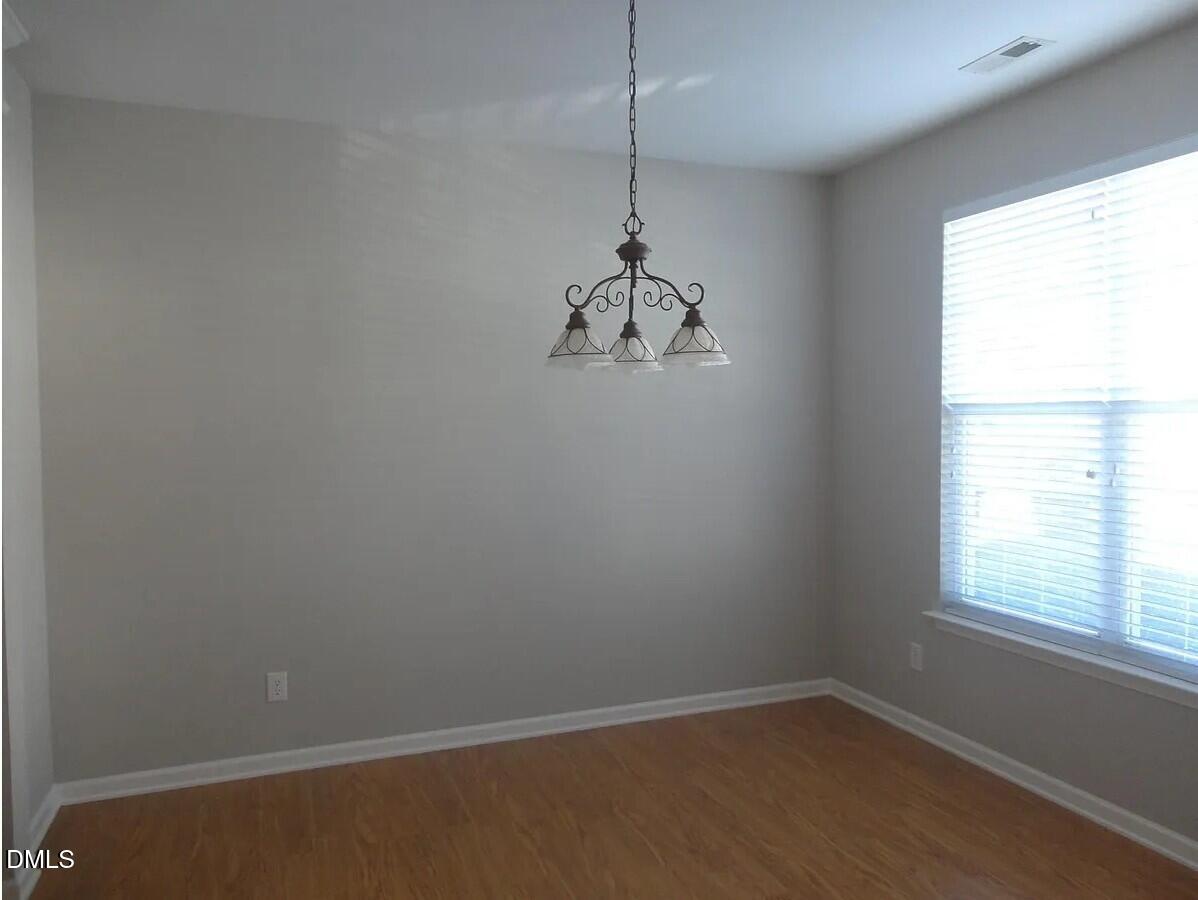 8455 Central Drive Raleigh, NC 27613 - Photo 2 of 7 a room with a window and a chandelier