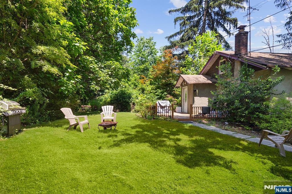 77 Voorhis Road Lincoln Park, NJ 07035 - Photo 17 of 21 a view of a chair and table in backyard of the house