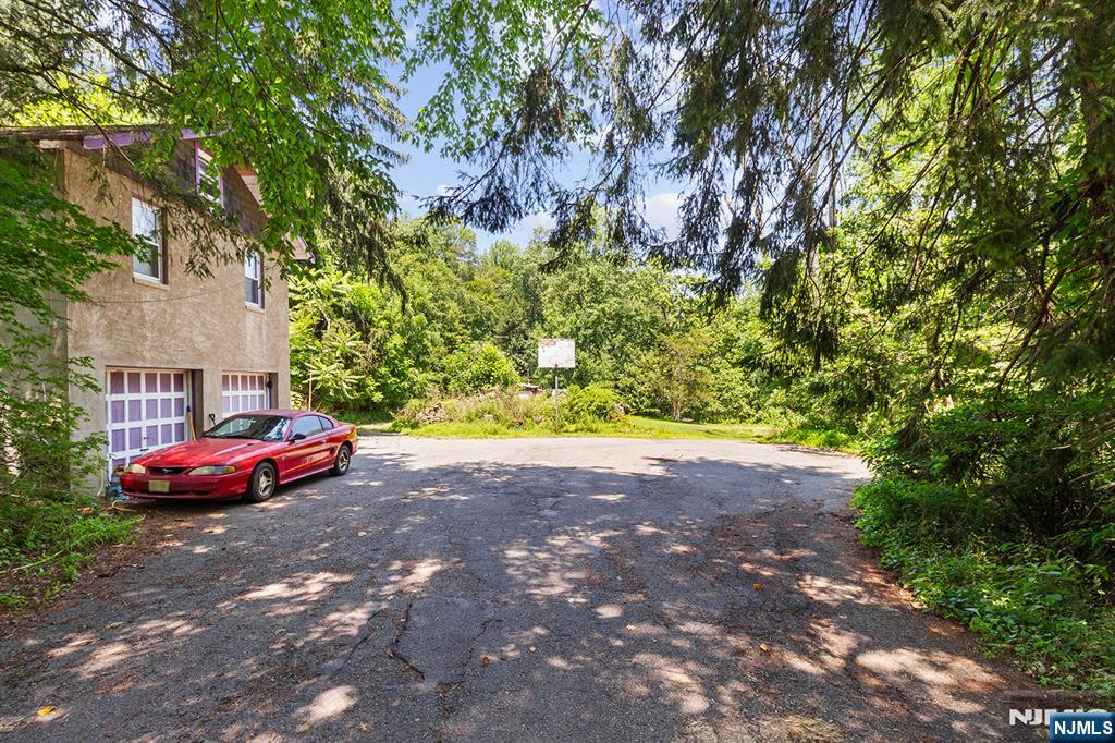 77 Voorhis Road Lincoln Park, NJ 07035 - Photo 19 of 21 a front view of a house with a yard