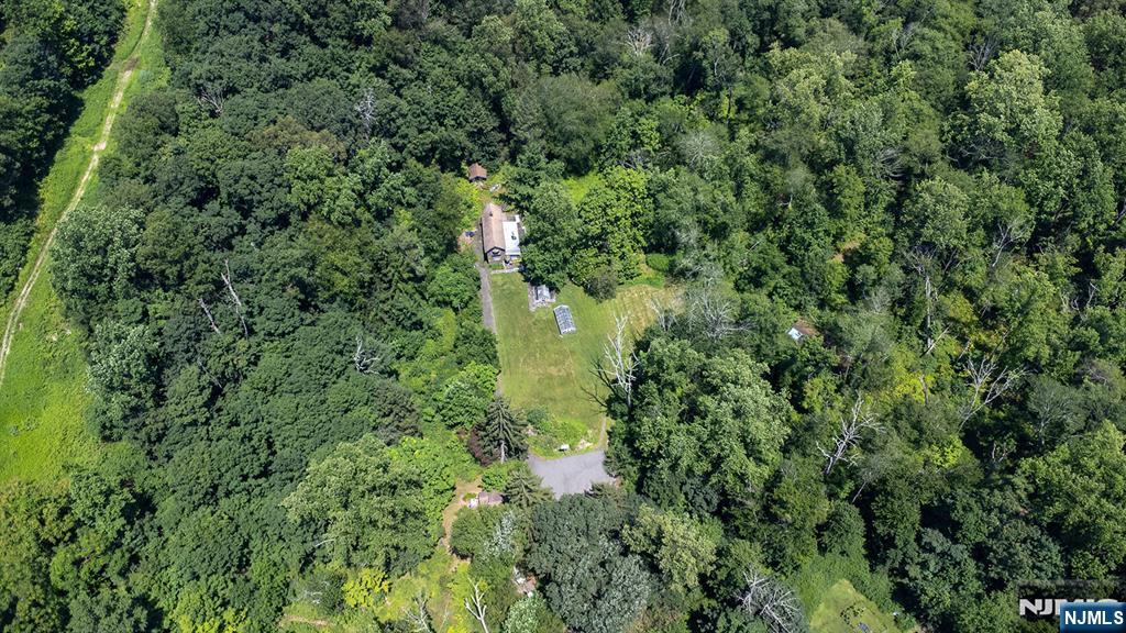 77 Voorhis Road Lincoln Park, NJ 07035 - Photo 4 of 21 an aerial view of residential house with outdoor space and trees all around