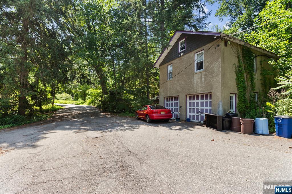 77 Voorhis Road Lincoln Park, NJ 07035 - Photo 10 of 21 a view of a house with a yard and garage