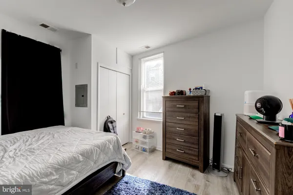 a bedroom with a bed and furniture