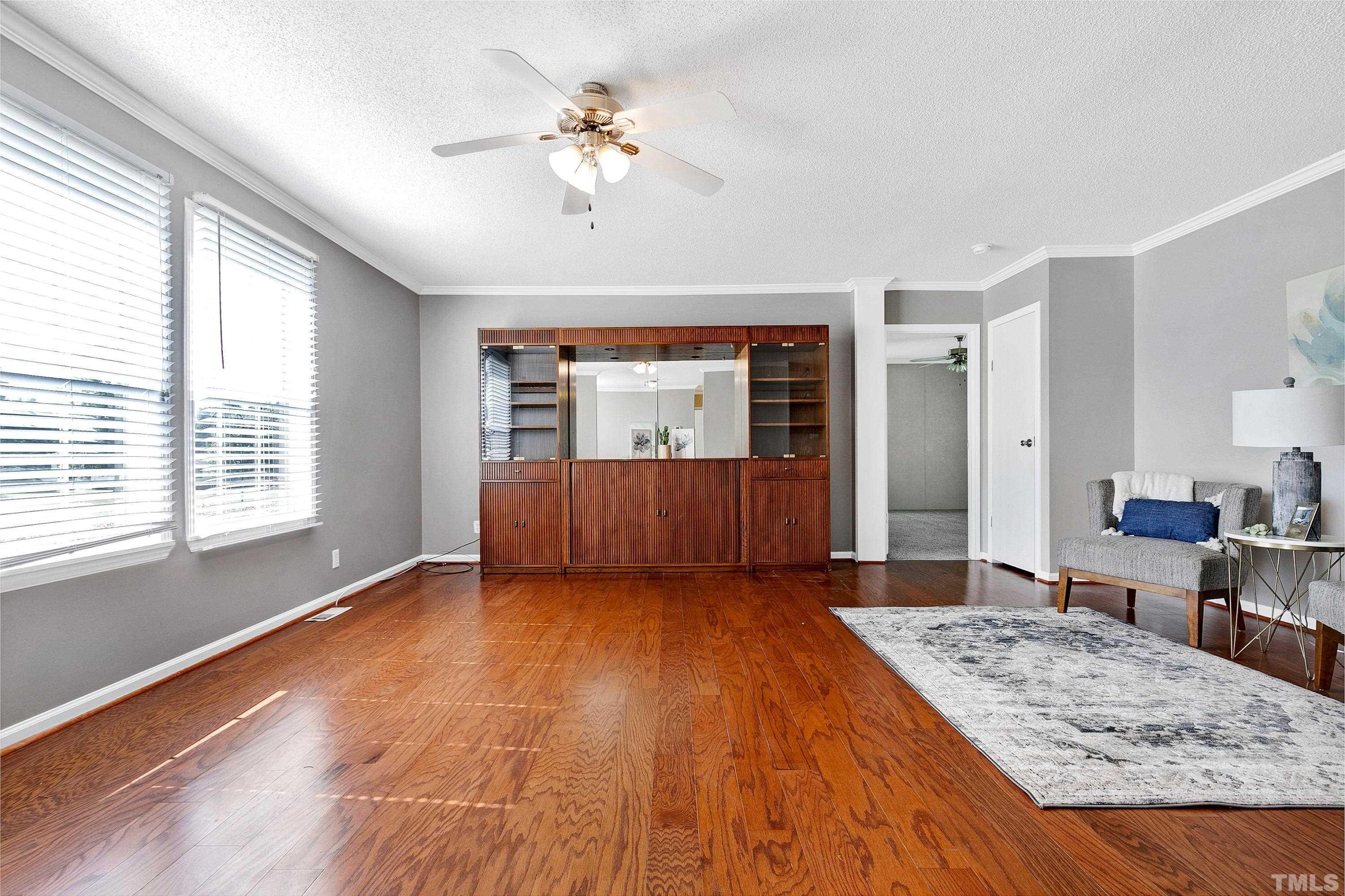 8308 South Creek Road Willow Spring, NC 27592 - Photo 14 of 42 a view of a livingroom with furniture window and wooden floor