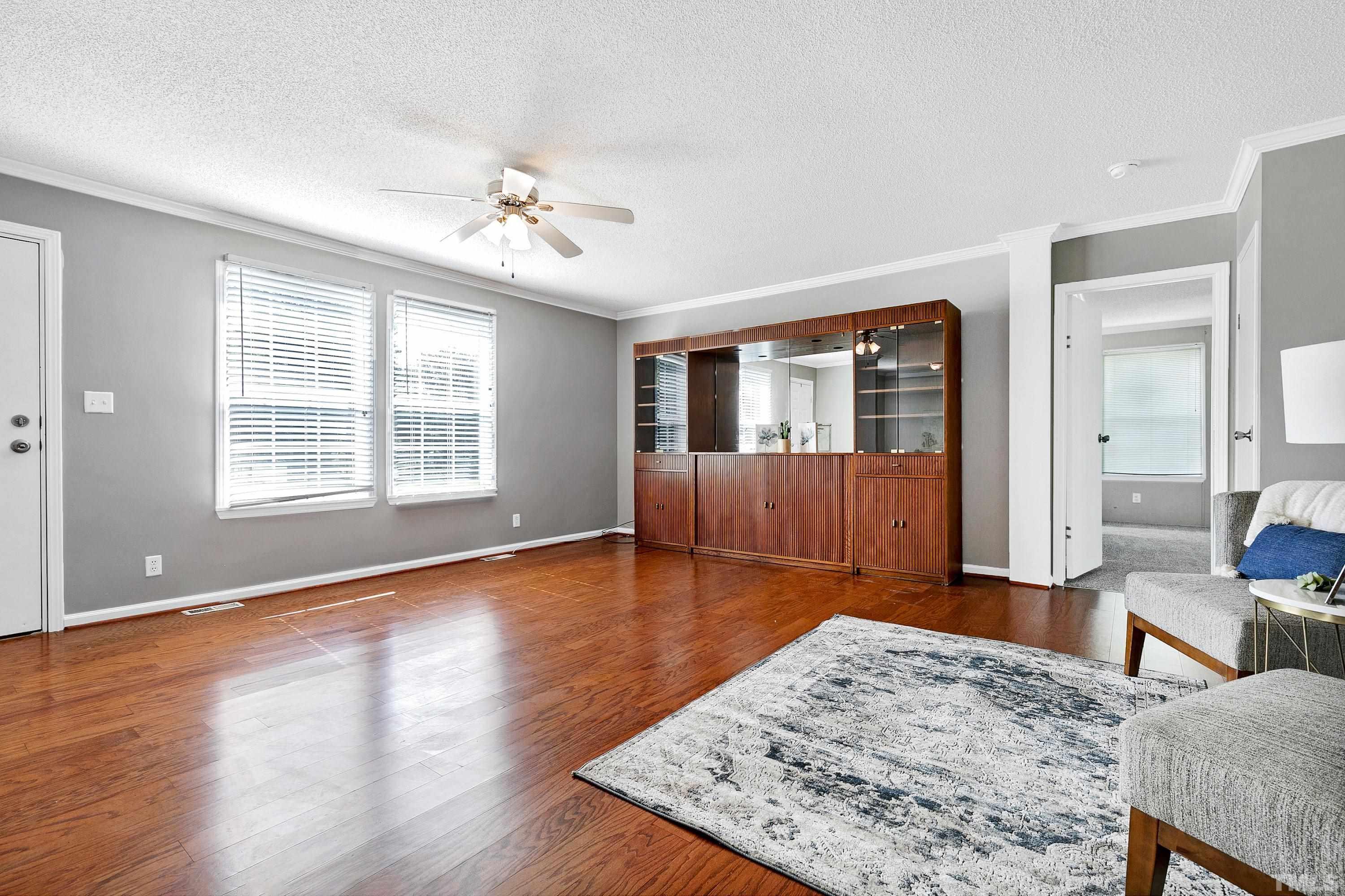 8308 South Creek Road Willow Spring, NC 27592 - Photo 15 of 42 a living room with a couch