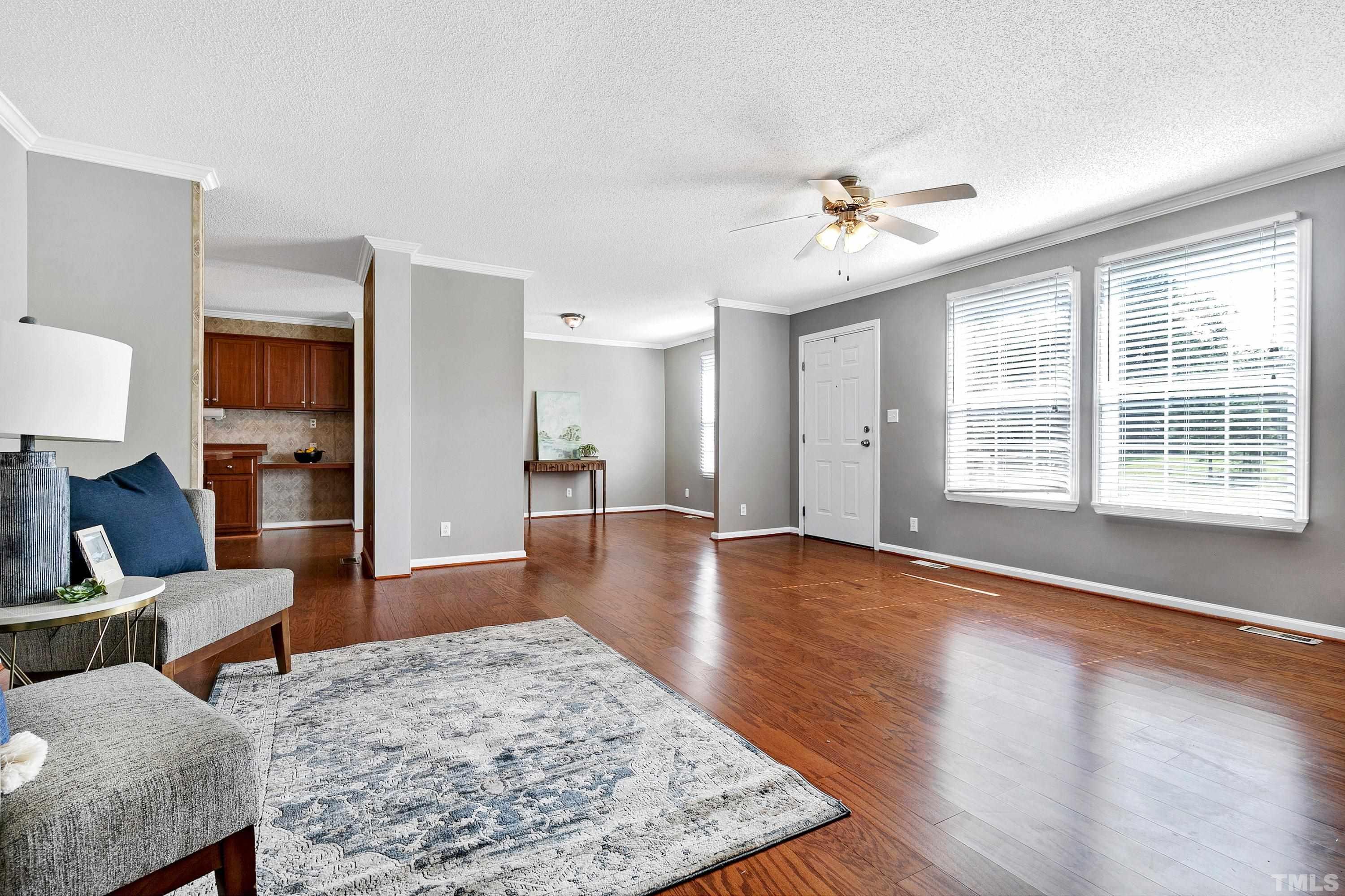 8308 South Creek Road Willow Spring, NC 27592 - Photo 16 of 42 a living room with furniture and wooden floor