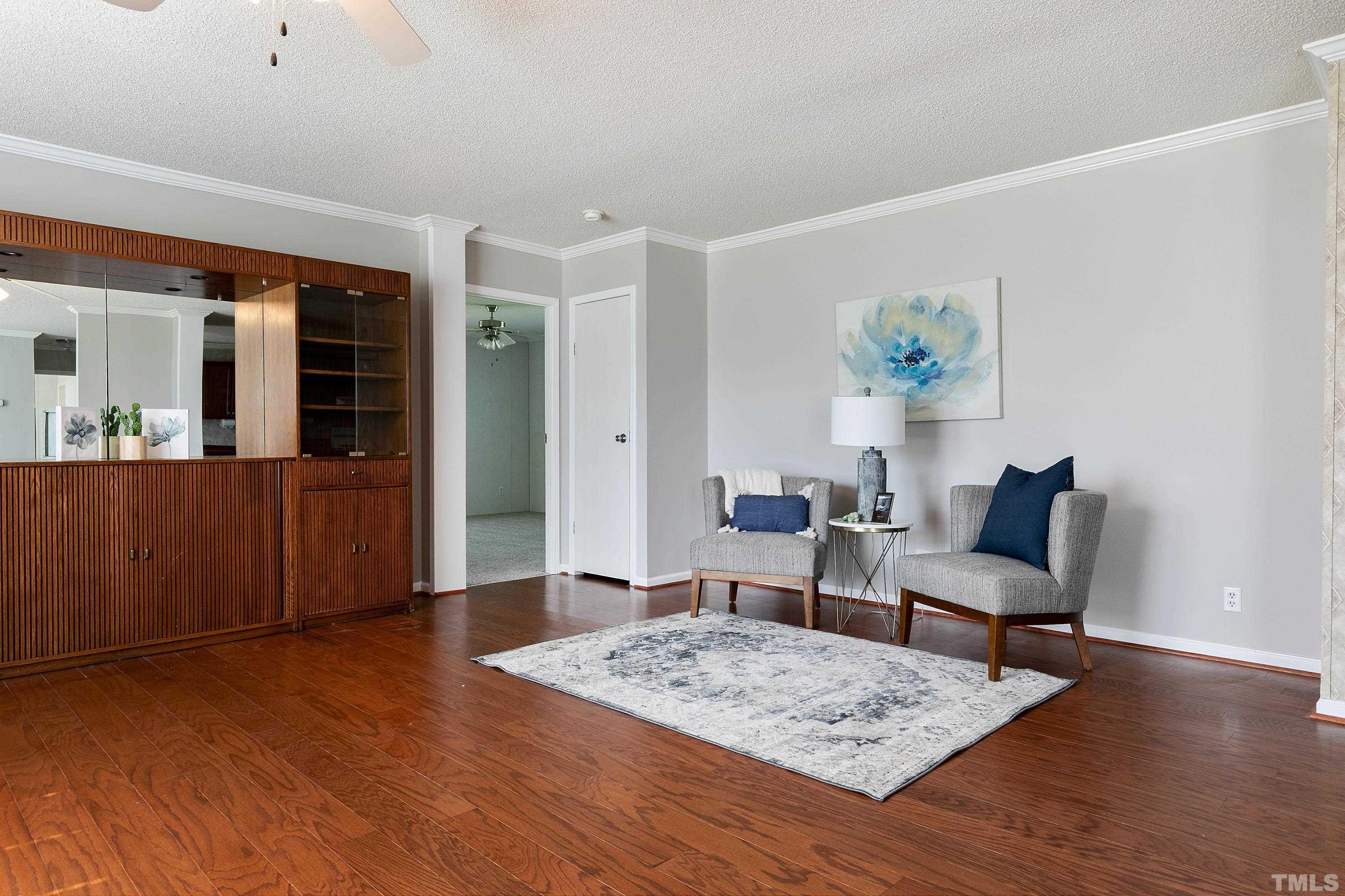8308 South Creek Road Willow Spring, NC 27592 - Photo 19 of 42 a living room with furniture and wooden floor