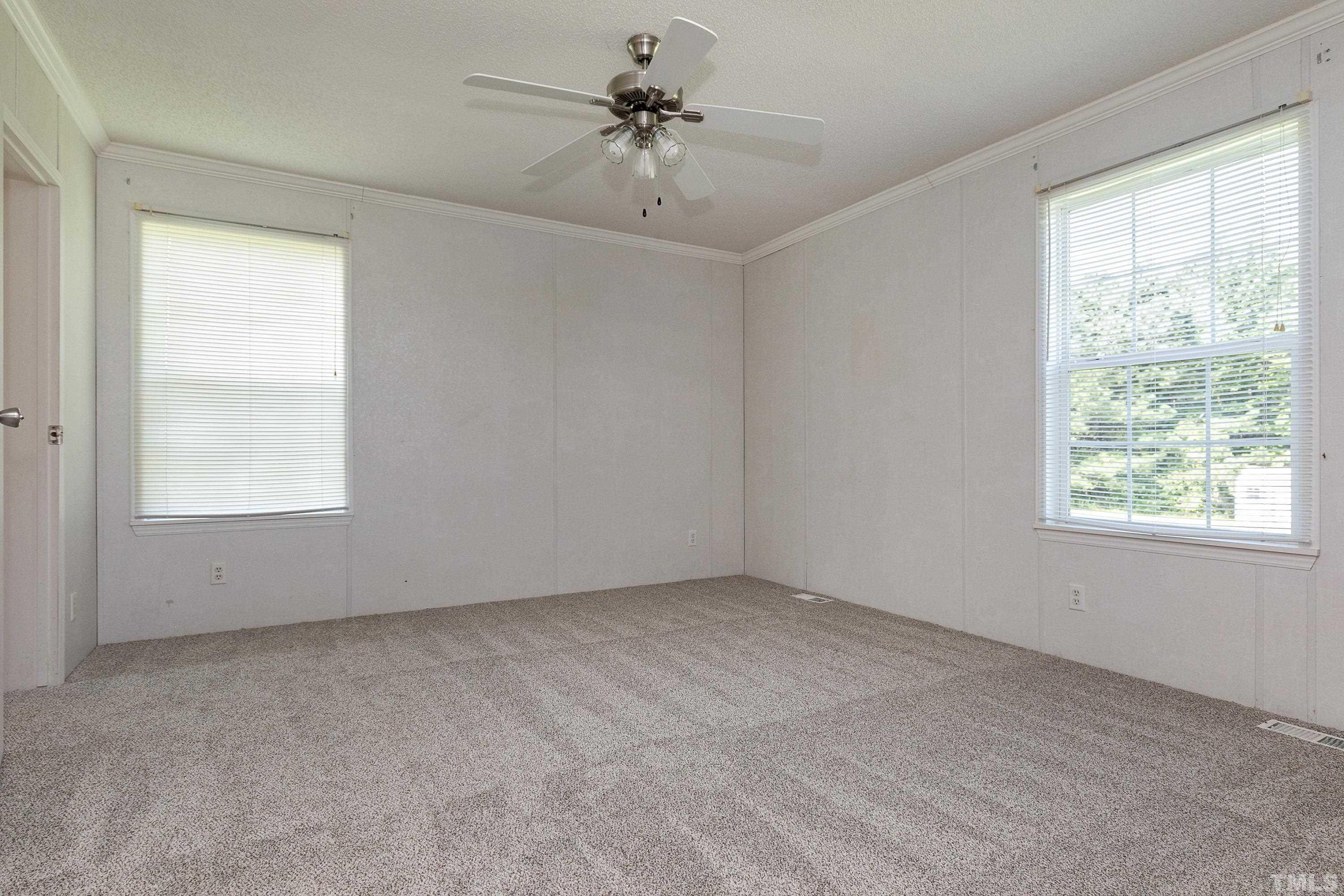 8308 South Creek Road Willow Spring, NC 27592 - Photo 28 of 42 a view of an empty room with a window