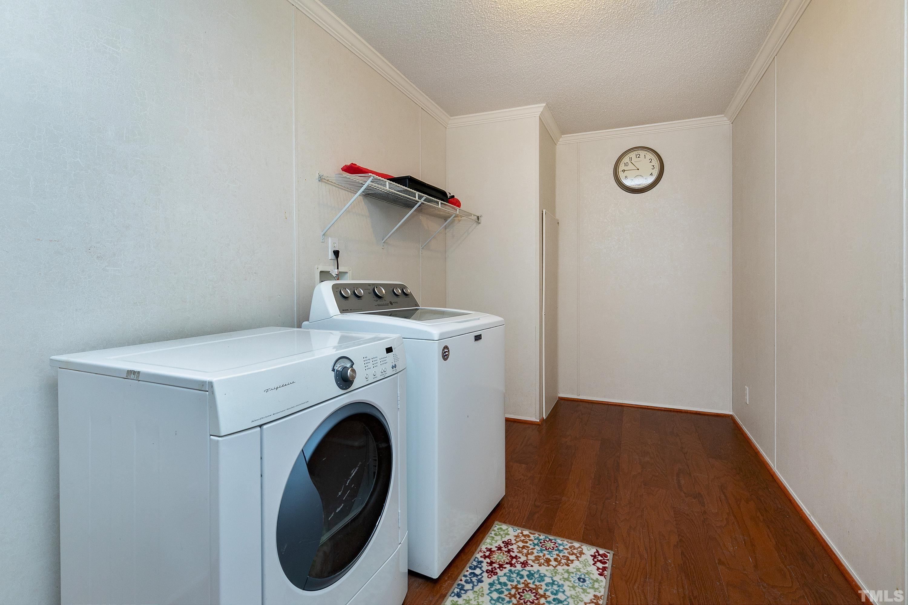 8308 South Creek Road Willow Spring, NC 27592 - Photo 36 of 42 a utility room with dryer and washer