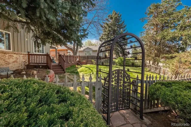 a balcony with furniture and wooden floor