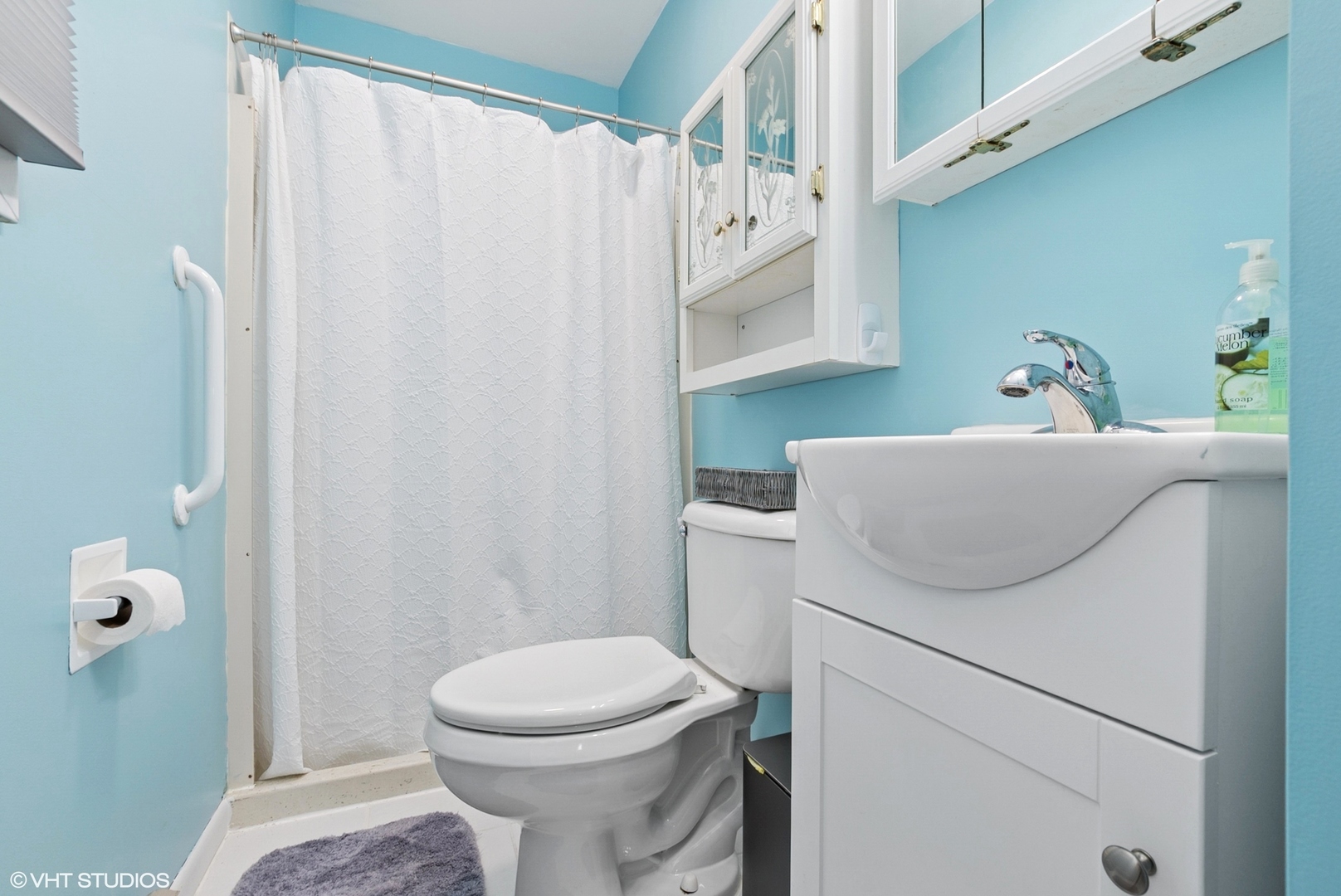 828 South Cedar Road New Lenox, IL 60451 - Photo 10 of 20 a bathroom with a sink a toilet and shower curtain