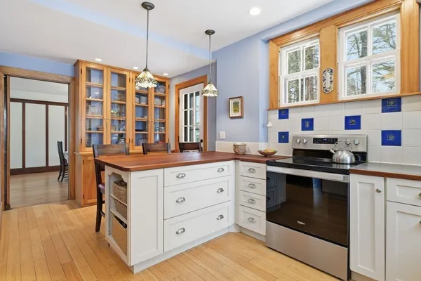 a kitchen with stainless steel appliances granite countertop a stove and a sink