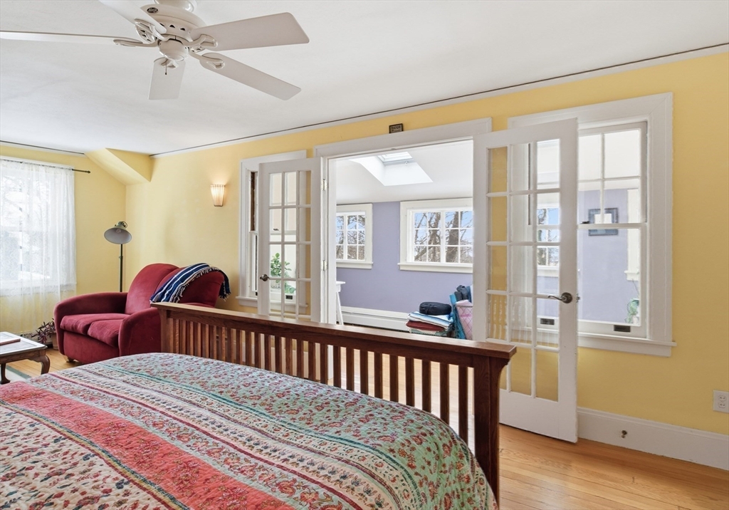 50 Mount Pleasant Amherst, MA 01002 - Photo 21 of 42 a bedroom with a bed and wooden floor