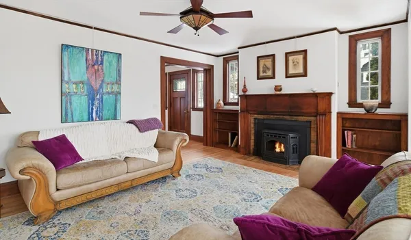 a living room with furniture and a fireplace