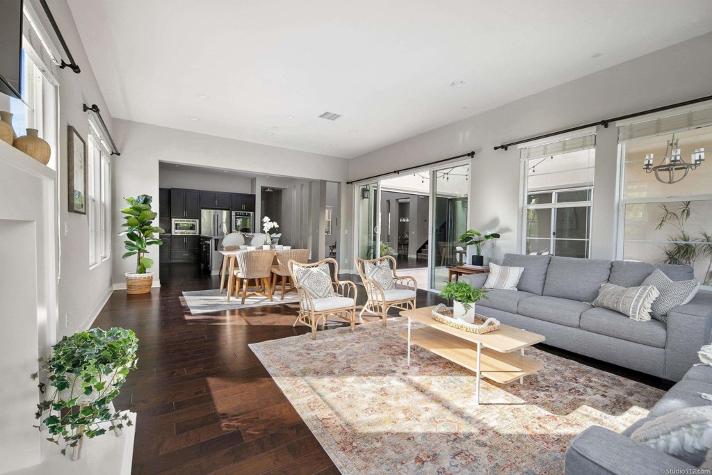 7060 Sitio Caliente Carlsbad, CA 92009 - Photo 14 of 39 a living room with furniture and a large window
