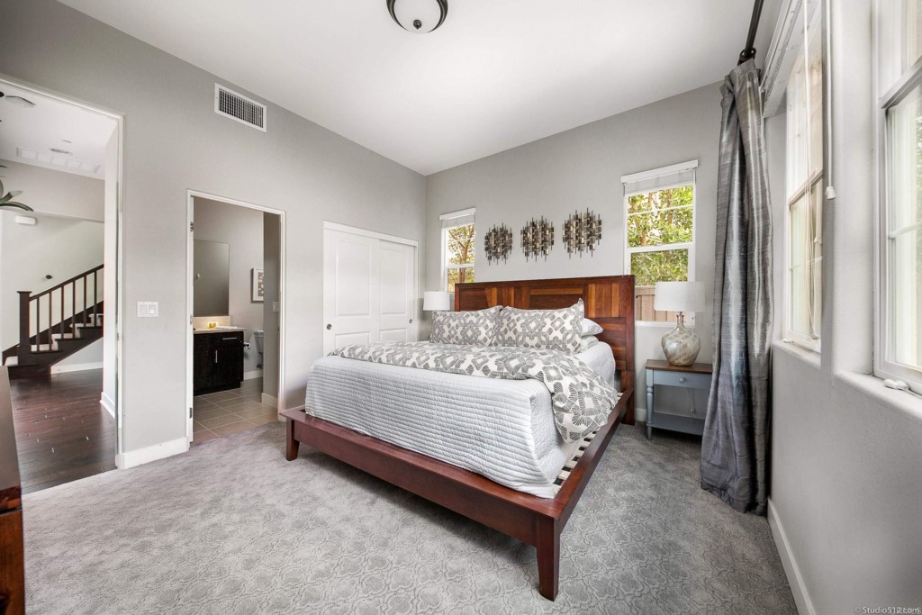 7060 Sitio Caliente Carlsbad, CA 92009 - Photo 15 of 39 a room with a bed and a window