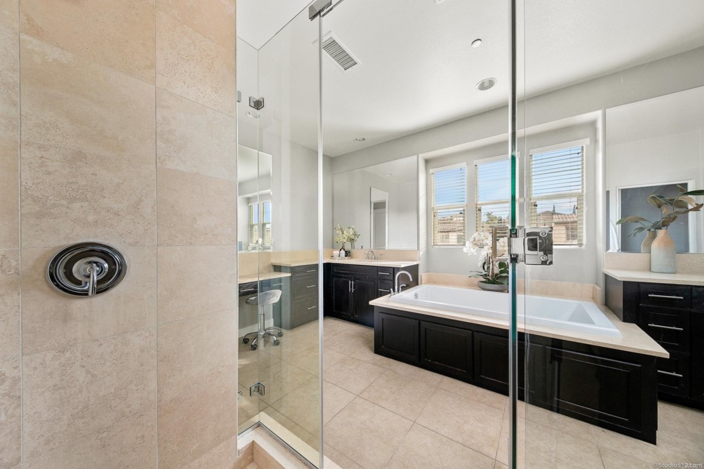 7060 Sitio Caliente Carlsbad, CA 92009 - Photo 22 of 39 a bedroom with a bed and a table