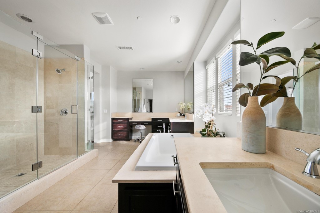 7060 Sitio Caliente Carlsbad, CA 92009 - Photo 23 of 39 a large white kitchen with a large window