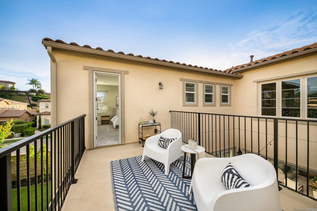 7060 Sitio Caliente Carlsbad, CA 92009 - Photo 25 of 39 a view of a balcony with furniture