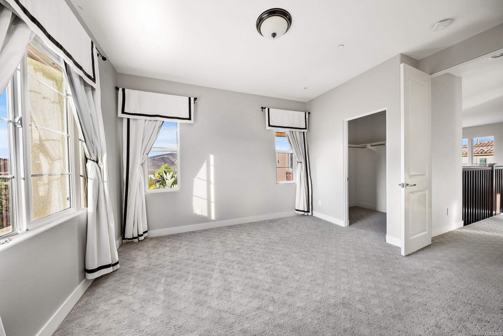 7060 Sitio Caliente Carlsbad, CA 92009 - Photo 27 of 39 a view of an empty room with a window