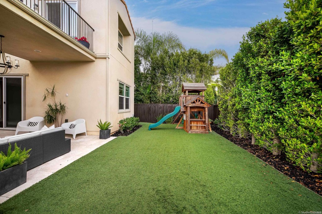 7060 Sitio Caliente Carlsbad, CA 92009 - Photo 30 of 39 a view of a house with backyard and porch