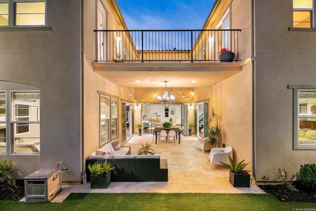 7060 Sitio Caliente Carlsbad, CA 92009 - Photo 32 of 39 a view of a living room and kitchen
