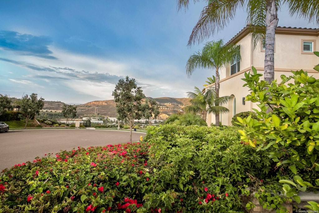 7060 Sitio Caliente Carlsbad, CA 92009 - Photo 5 of 39 a view of a lake with a garden