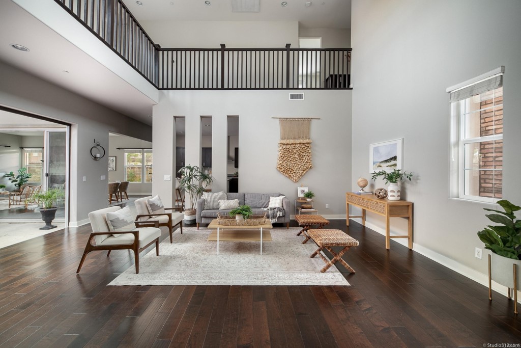 7060 Sitio Caliente Carlsbad, CA 92009 - Photo 8 of 39 a living room with furniture wooden floor and a table