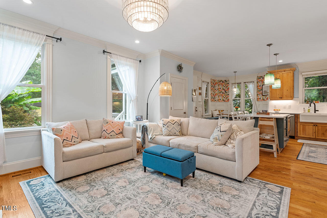 808 Elm Street Raleigh, NC 27604 - Photo 14 of 44 a living room with furniture wooden floor and a large window