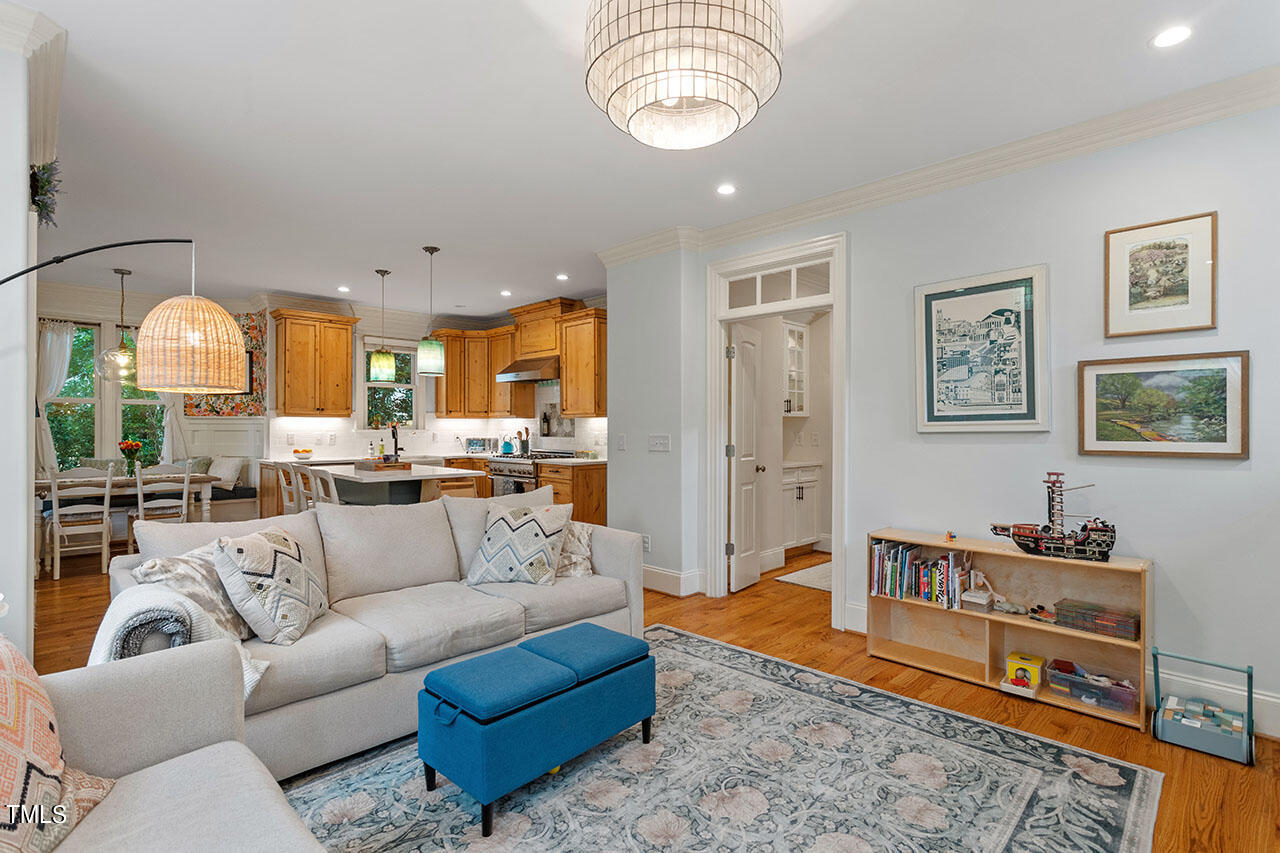 808 Elm Street Raleigh, NC 27604 - Photo 15 of 44 a view of living room kitchen with furniture and window