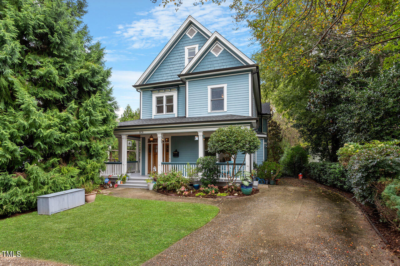 808 Elm Street Raleigh, NC 27604 - Photo 2 of 44 a front view of a house with a yard and porch