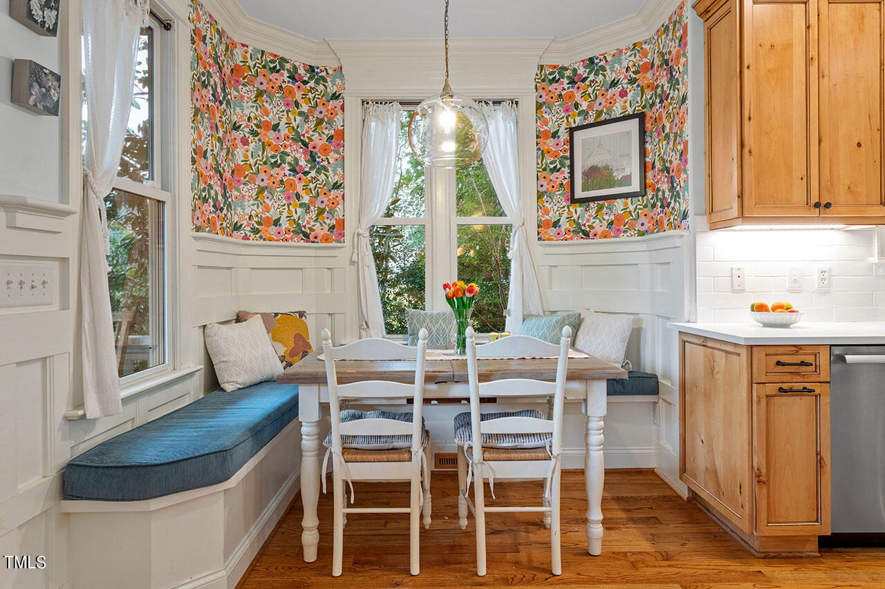 808 Elm Street Raleigh, NC 27604 - Photo 21 of 44 a dining room with furniture entryway and wooden floor