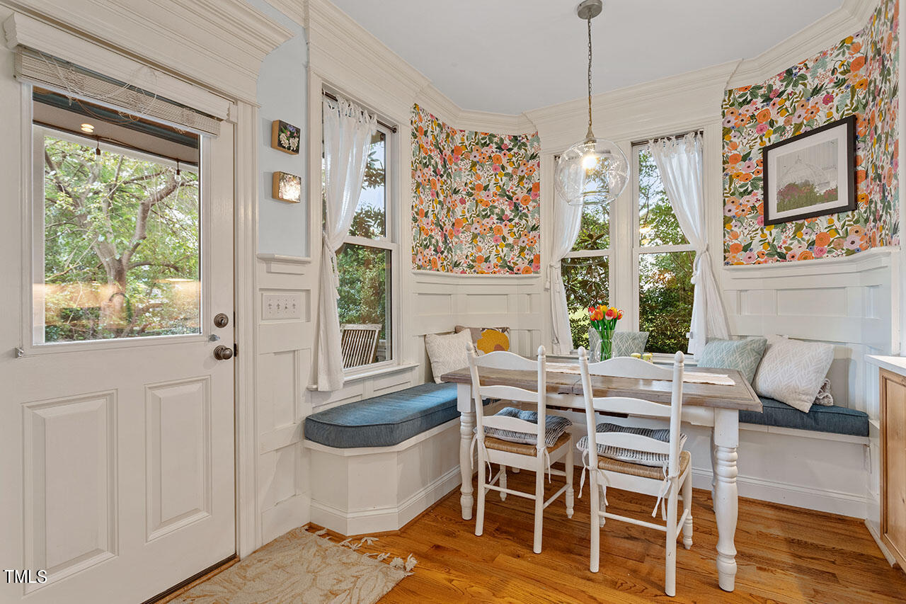 808 Elm Street Raleigh, NC 27604 - Photo 22 of 44 a dining room with furniture a chandelier and window